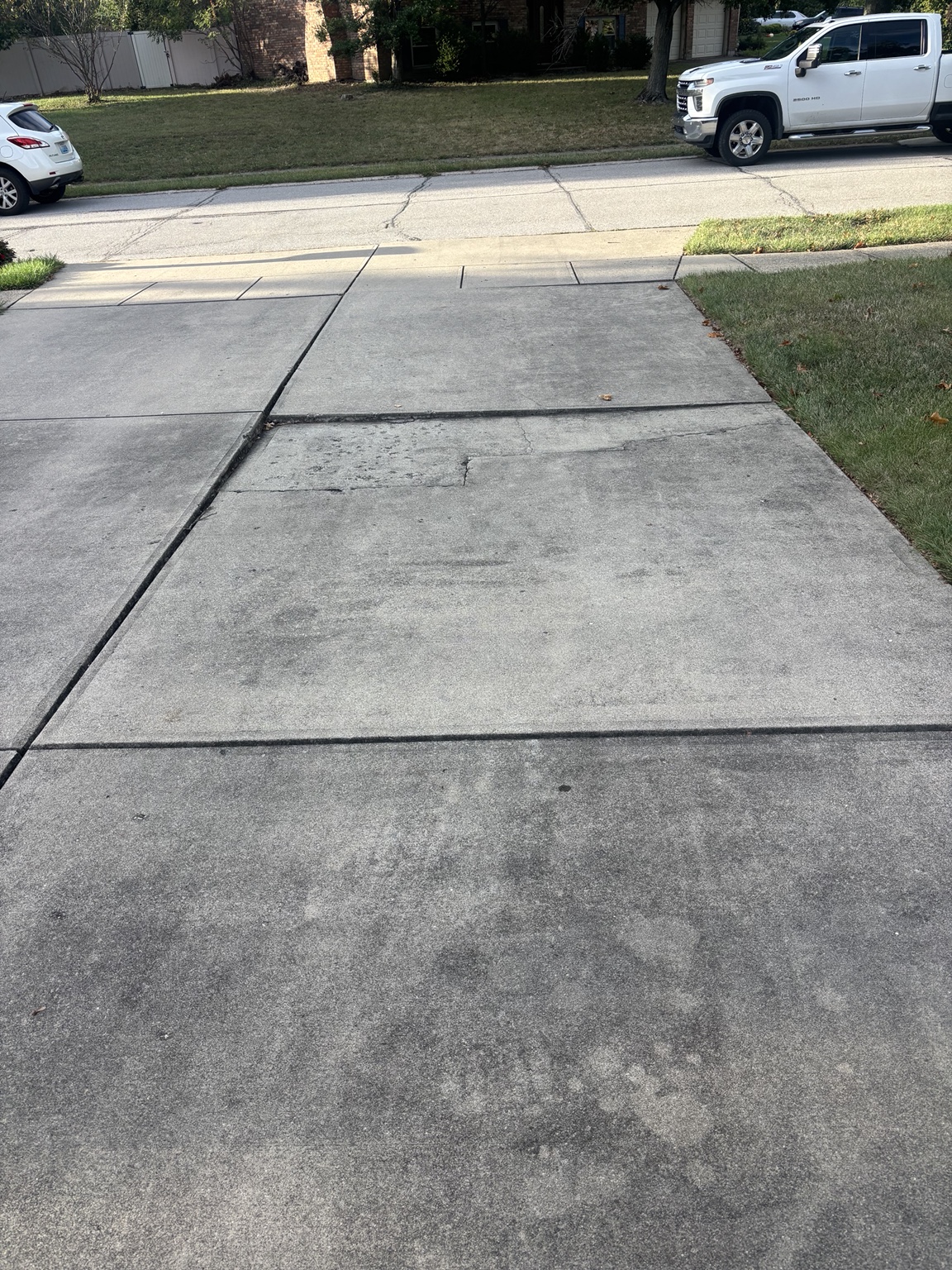 Cracked and sinking concrete driveway before replacement