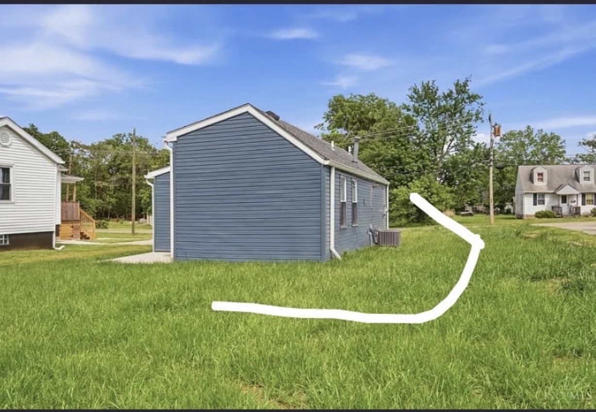 Yard sloping toward foundation before drainage grading
